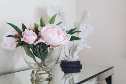 Pink peony arrangement in footed glass bowl