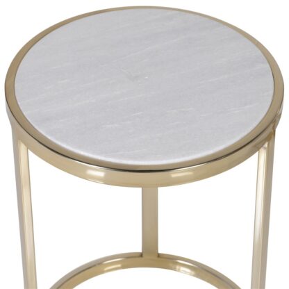 A Set Of Gold Nesting Tables With A White Marble Top