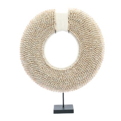 round shell decor on stand