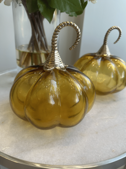 Round Amber glass decorative pumpkin with a gold stem