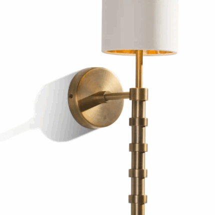 wall lamp with gold base and ivory shade